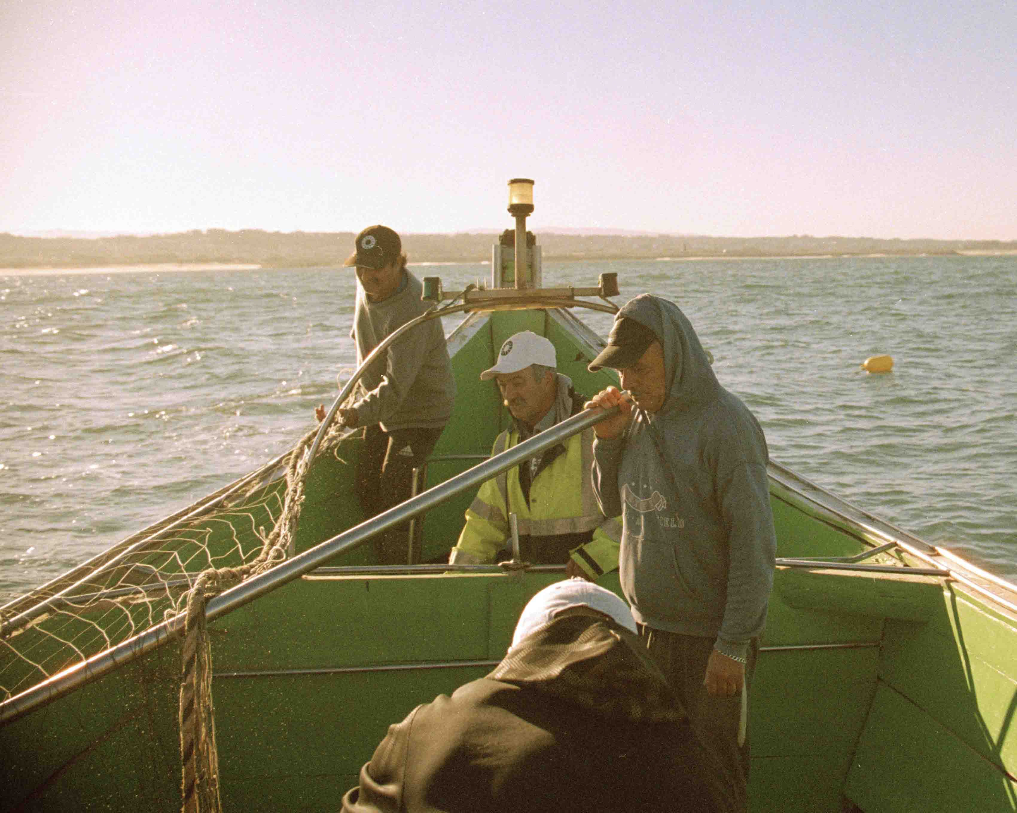 4 fishermen on a boat