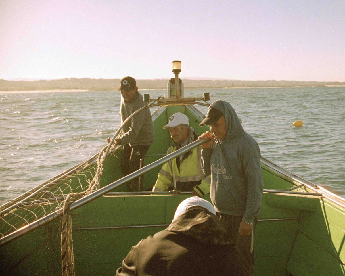 4 fishermen on a boat